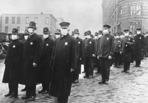Influenza Epidemic 1918 - Policemen in Seattle, Washington, wearing masks made by the Seattle Chapter of the Red Cross, during the influenza epidemic. (National Archives)